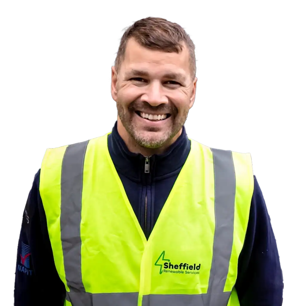 Construction worker in high-visibility vest smiling outdoors.